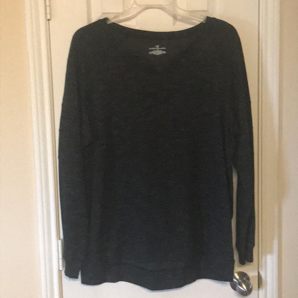 A woman’s high low V-neck sweater